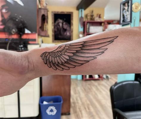 angel energy tattoo meaning|angel with wings tattoo designs.